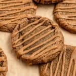 Gingerbread latte cookies stacked with a coffee glaze drizzle