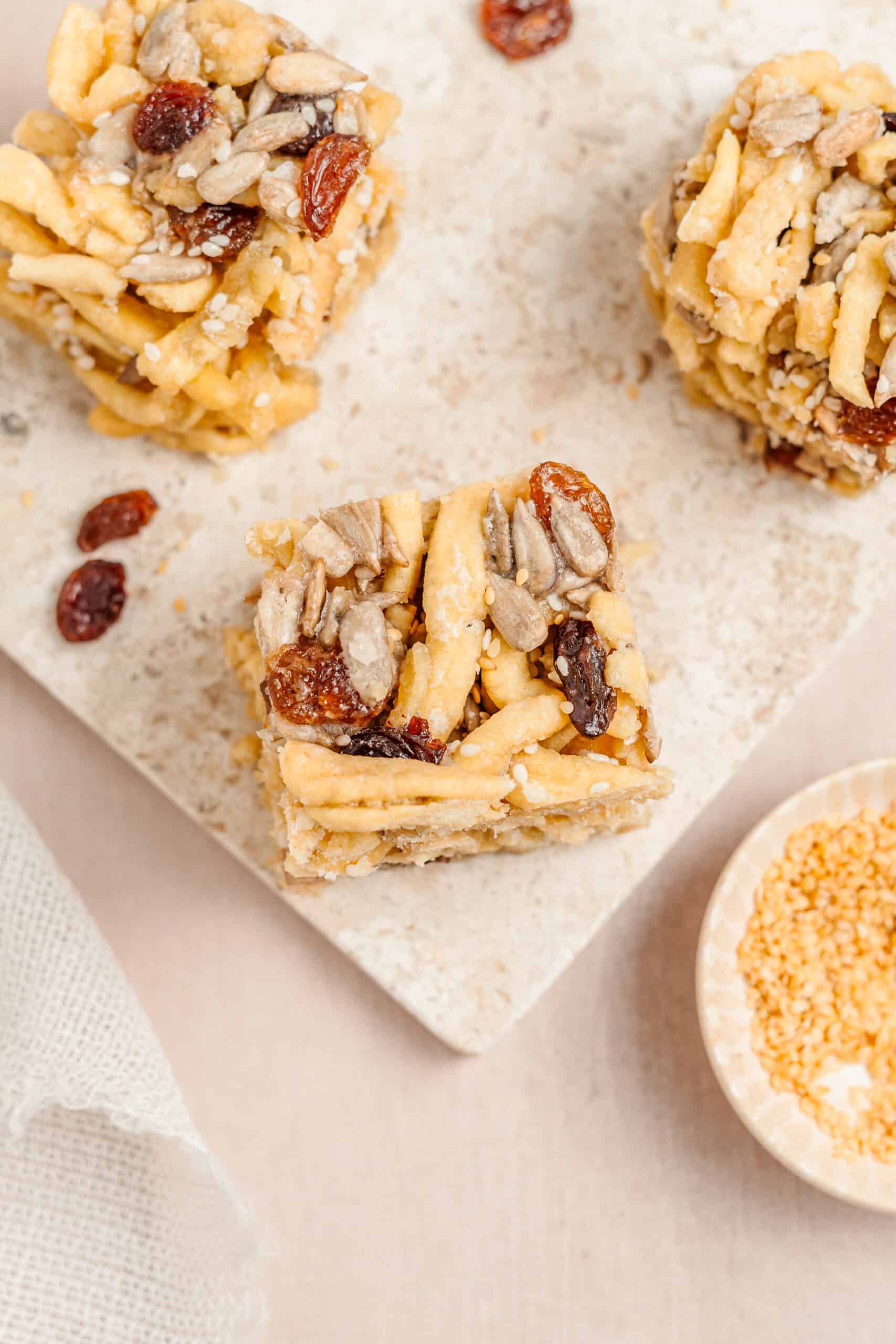 Sachima Bars Close Up - Catherine Zhang Close up of sachima bars showing golden noodle strands, raisins and sesame