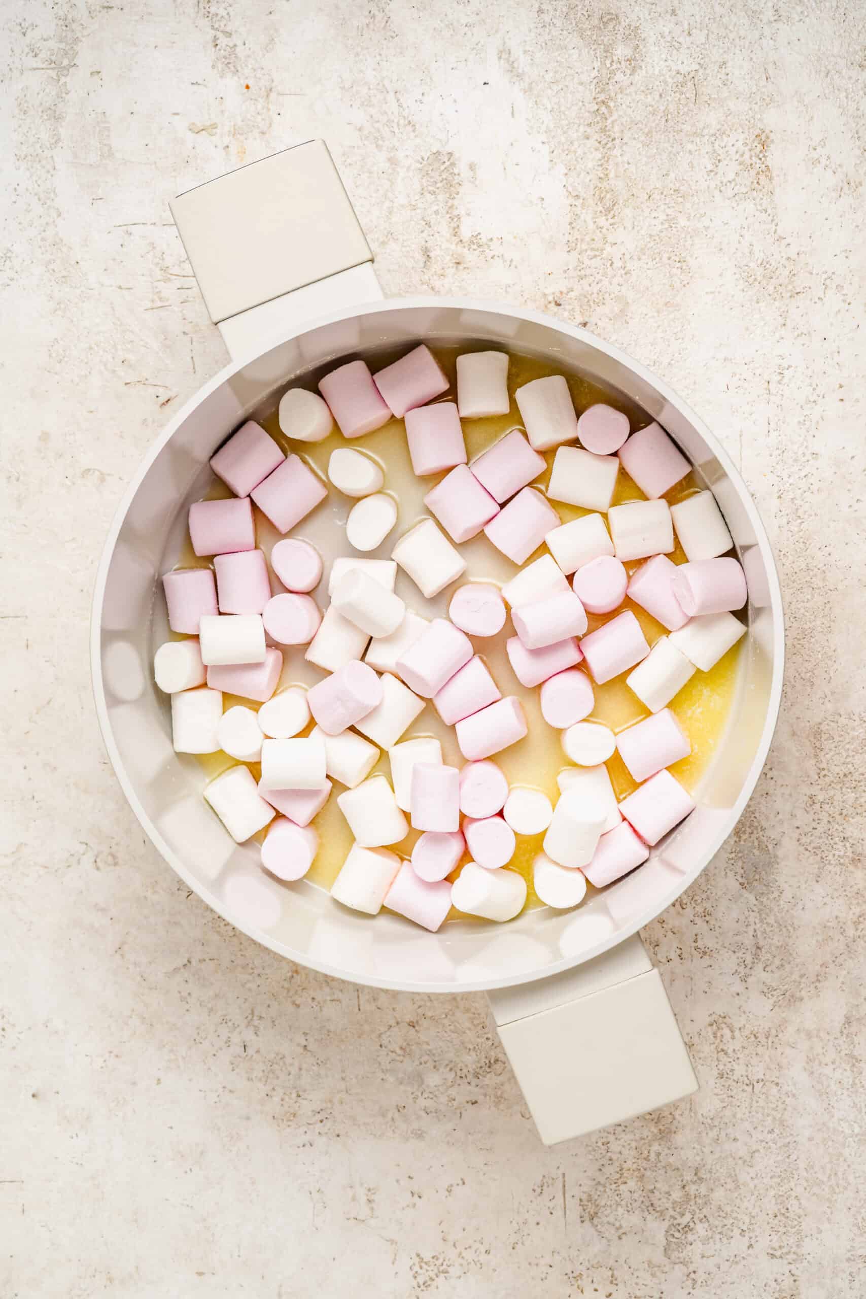 Marshmallows and butter melting in a pan for snowflake crisp - Catherine Zhang Marshmallows and butter melting in a pan for snowflake crisp