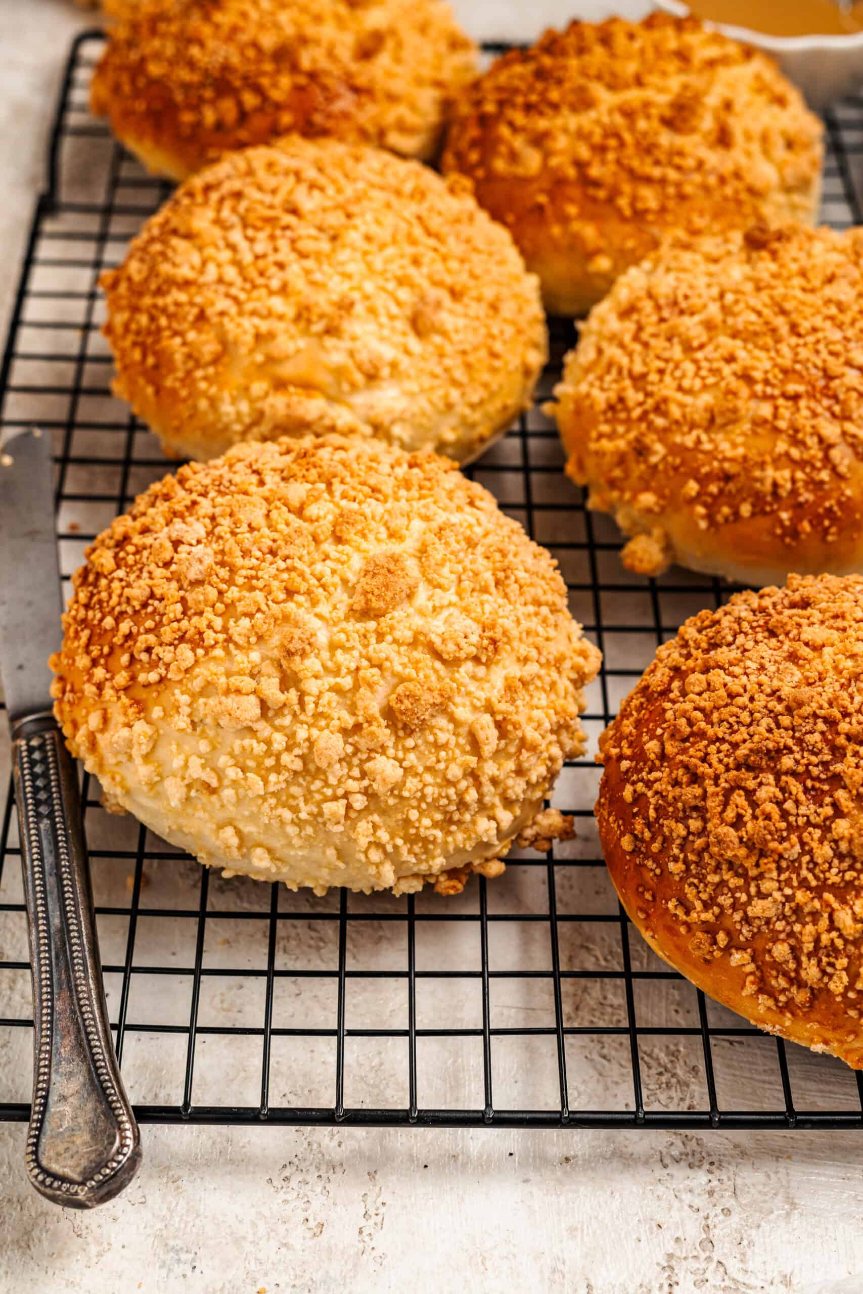 Close up of soboro bread with pebbled golden peanut streusel crust - Catherine Zhang Close up of soboro bread with pebbled golden peanut streusel crust