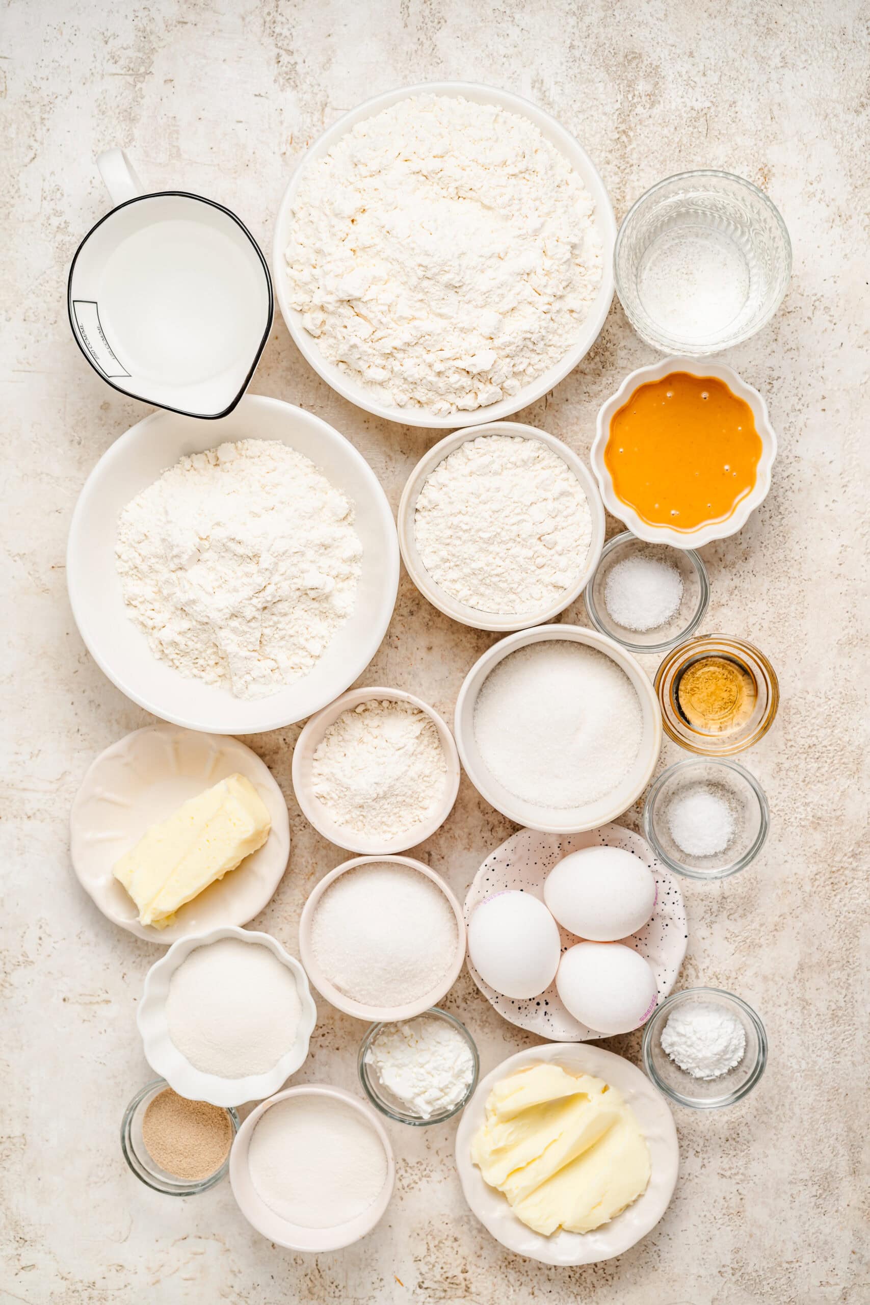 Soboro bread ingredients flat lay with bread flour, milk powder, butter and peanut butter - Catherine Zhang Soboro bread ingredients flat lay with bread flour, milk powder, butter and peanut butter