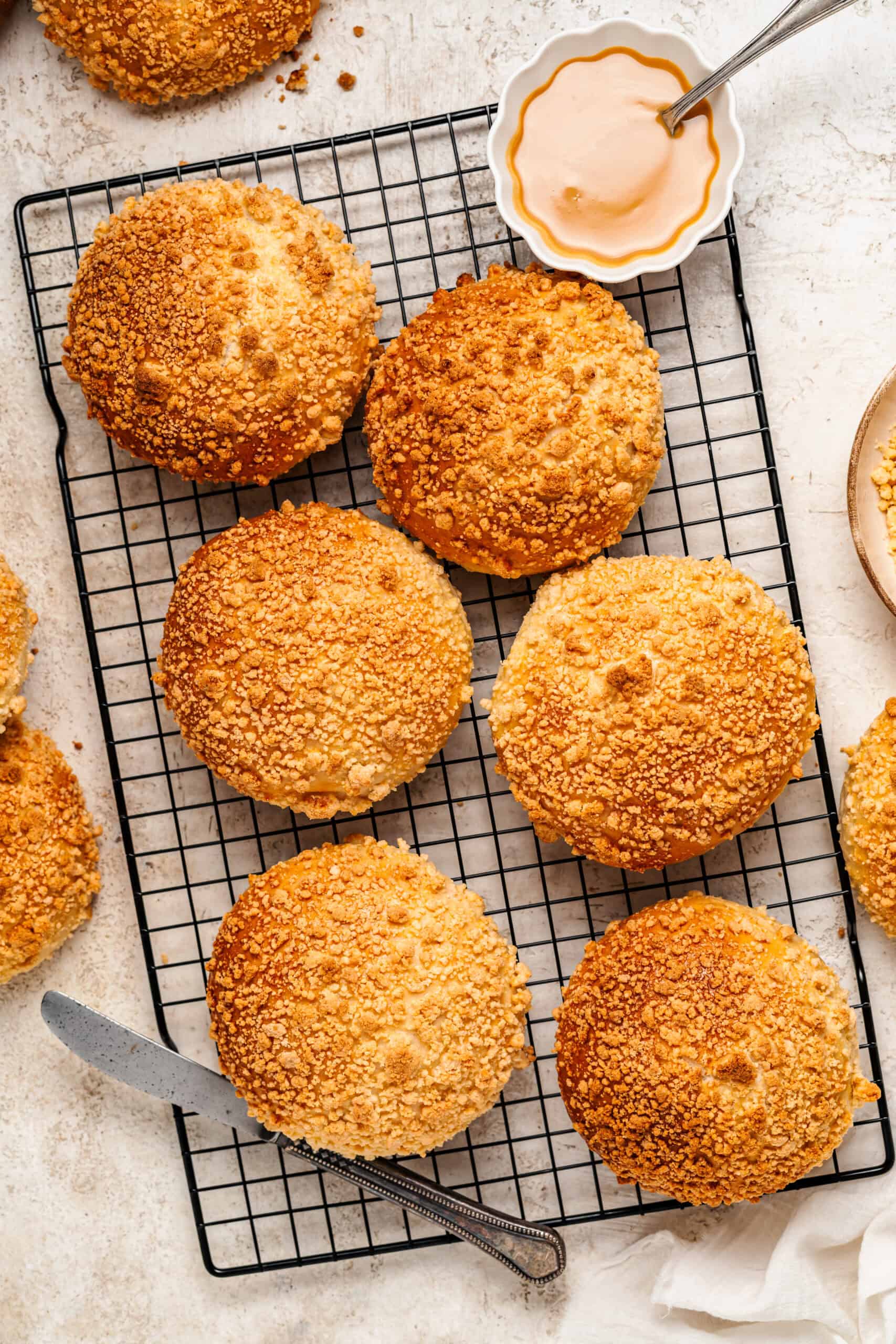 Soboro bread buns dusted and styled beside a coffee on a wire rack - Catherine Zhang Soboro bread buns dusted and styled beside a coffee on a wire rack