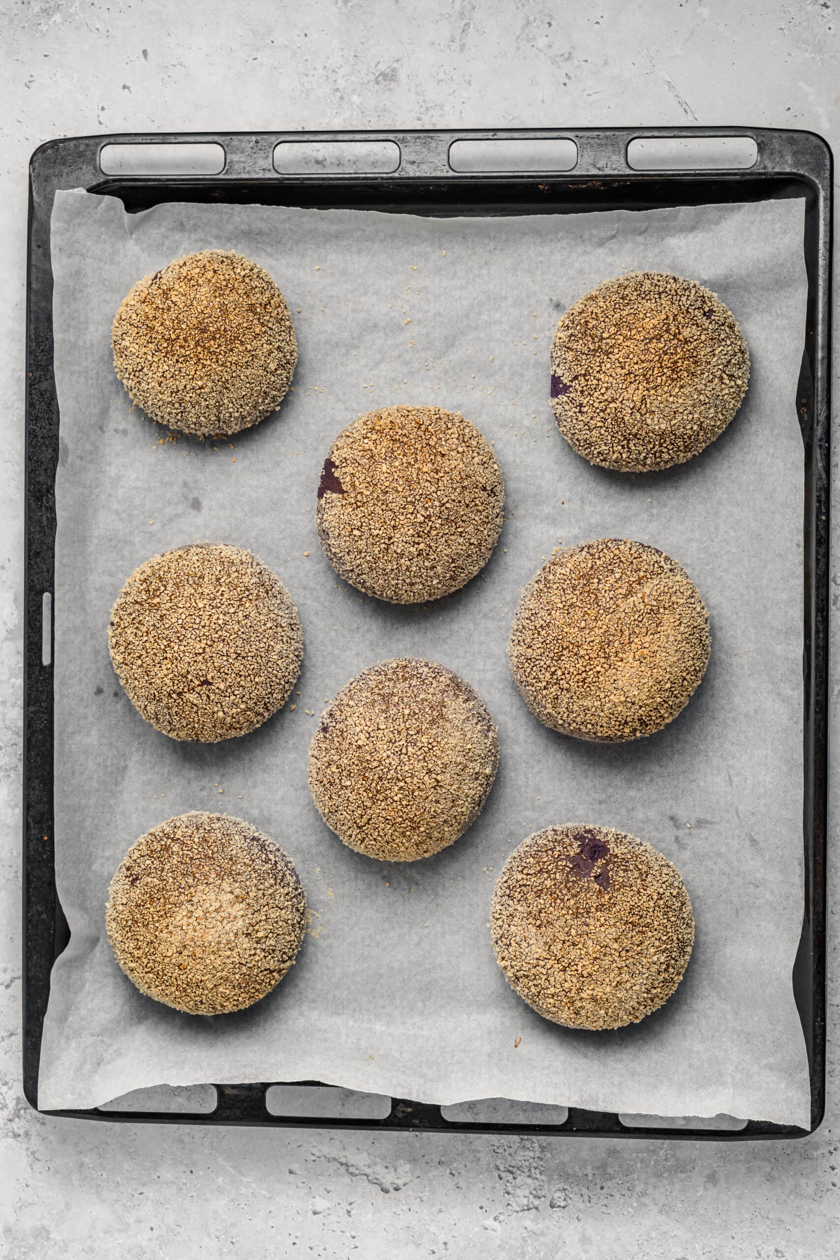Baked Ube Cheese Pandesal - Catherine Zhang Golden baked ube cheese pandesal rolls on a tray fresh from the oven