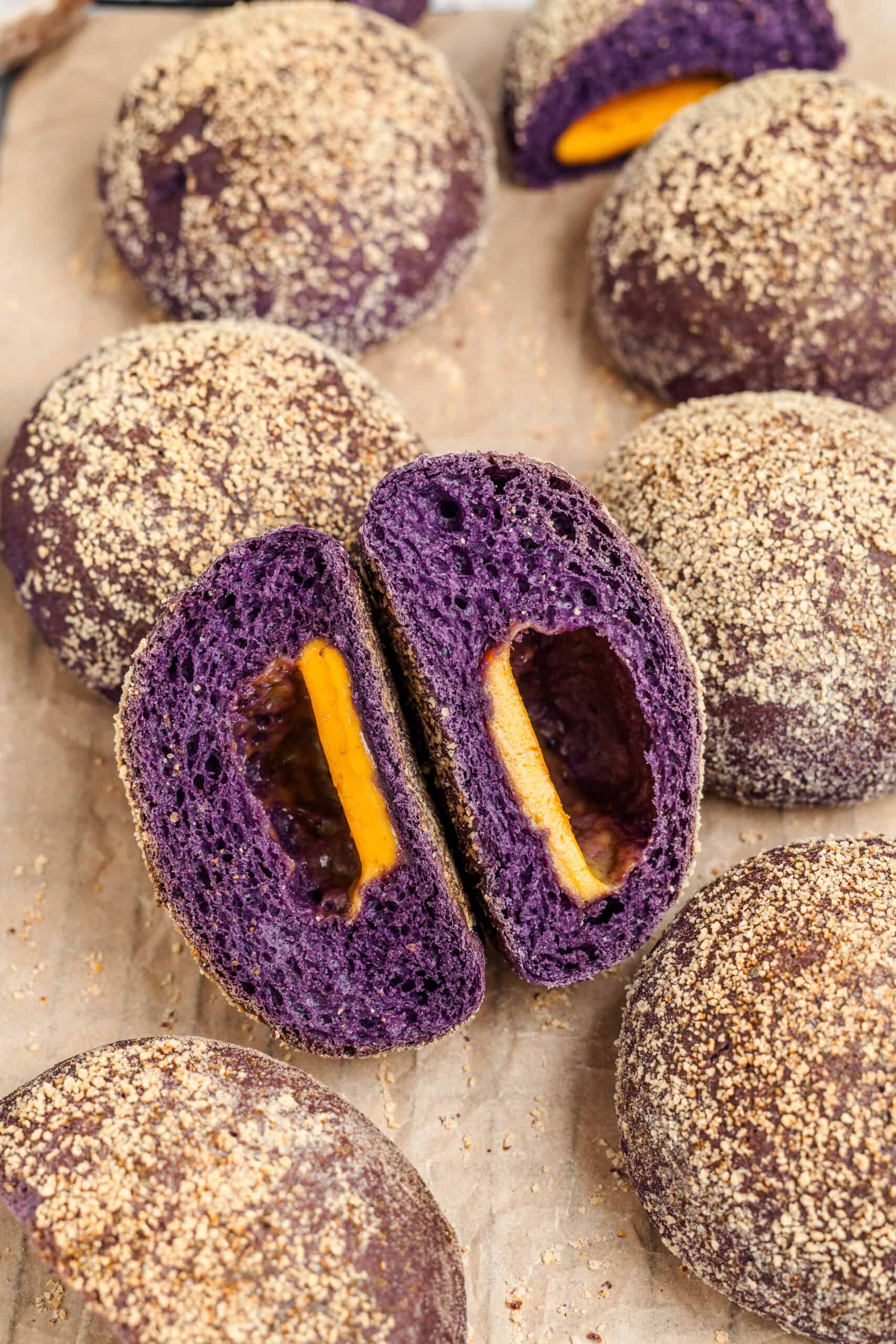 Ube Cheese Pandesal Purple Crumb - Catherine Zhang Two ube cheese pandesal halves showing the deep purple crumb and cheese cavity