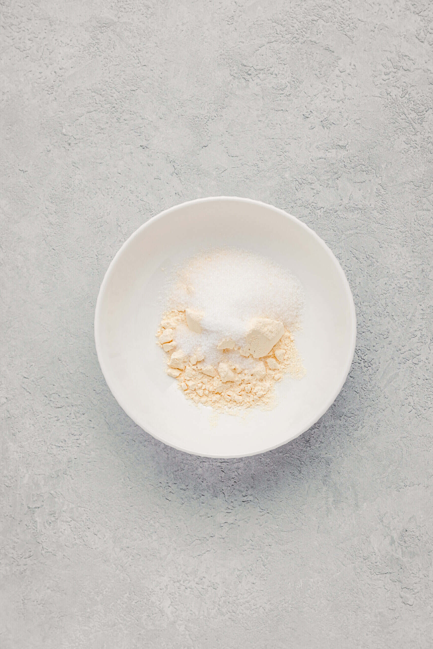 Kinako roasted soybean flour, sugar and salt in a white bowl for warabimochi coating - Catherine Zhang Kinako roasted soybean flour, sugar and salt in a white bowl for the warabimochi coating