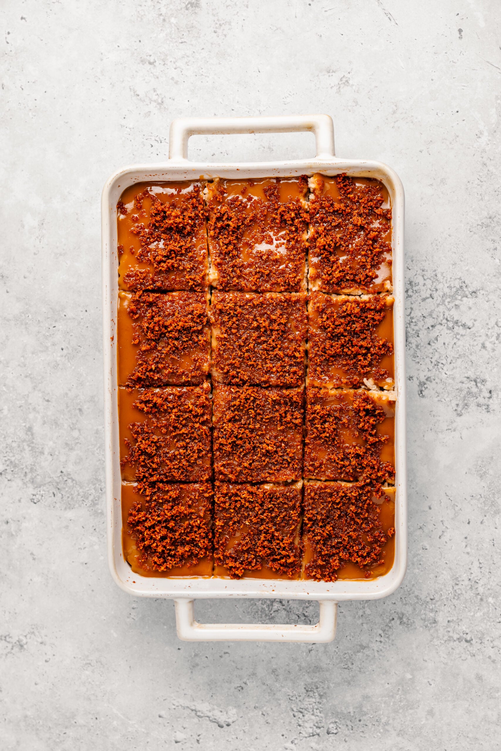 Filipino biko cut into twelve squares in the baking dish - Catherine Zhang Filipino biko cut into twelve squares in the baking dish