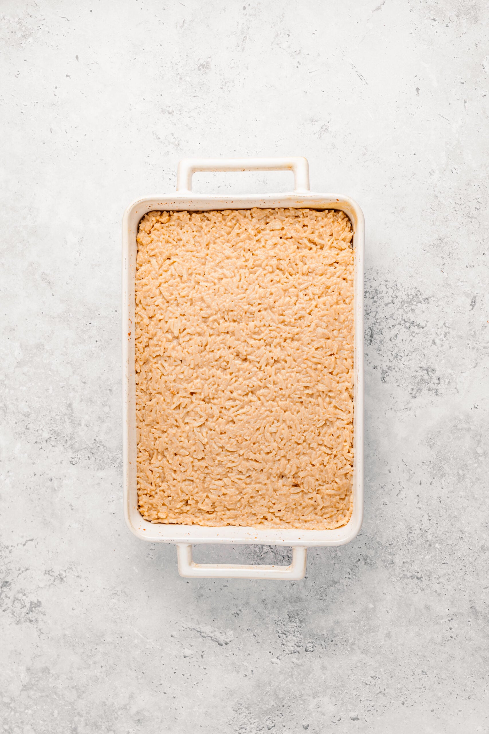 Biko rice mixture pressed firmly into a greased baking dish and levelled - Catherine Zhang Biko rice mixture pressed firmly into a greased baking dish and levelled