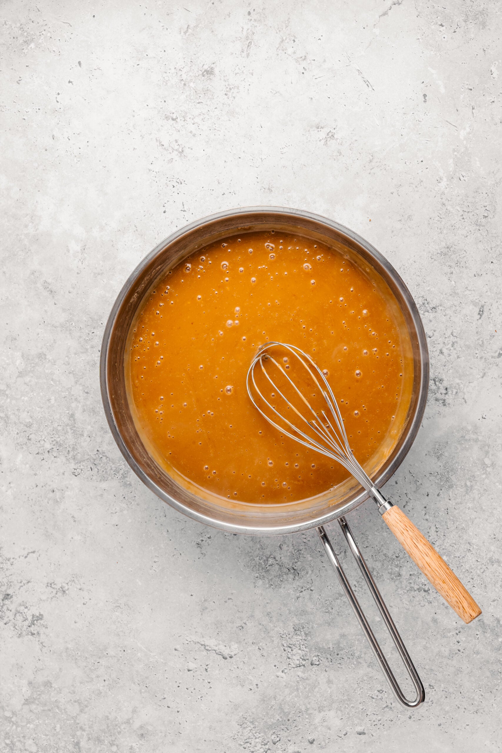 Coconut caramel thickened and darkened in the pan for Filipino biko - Catherine Zhang Coconut caramel thickened and darkened in the pan for Filipino biko