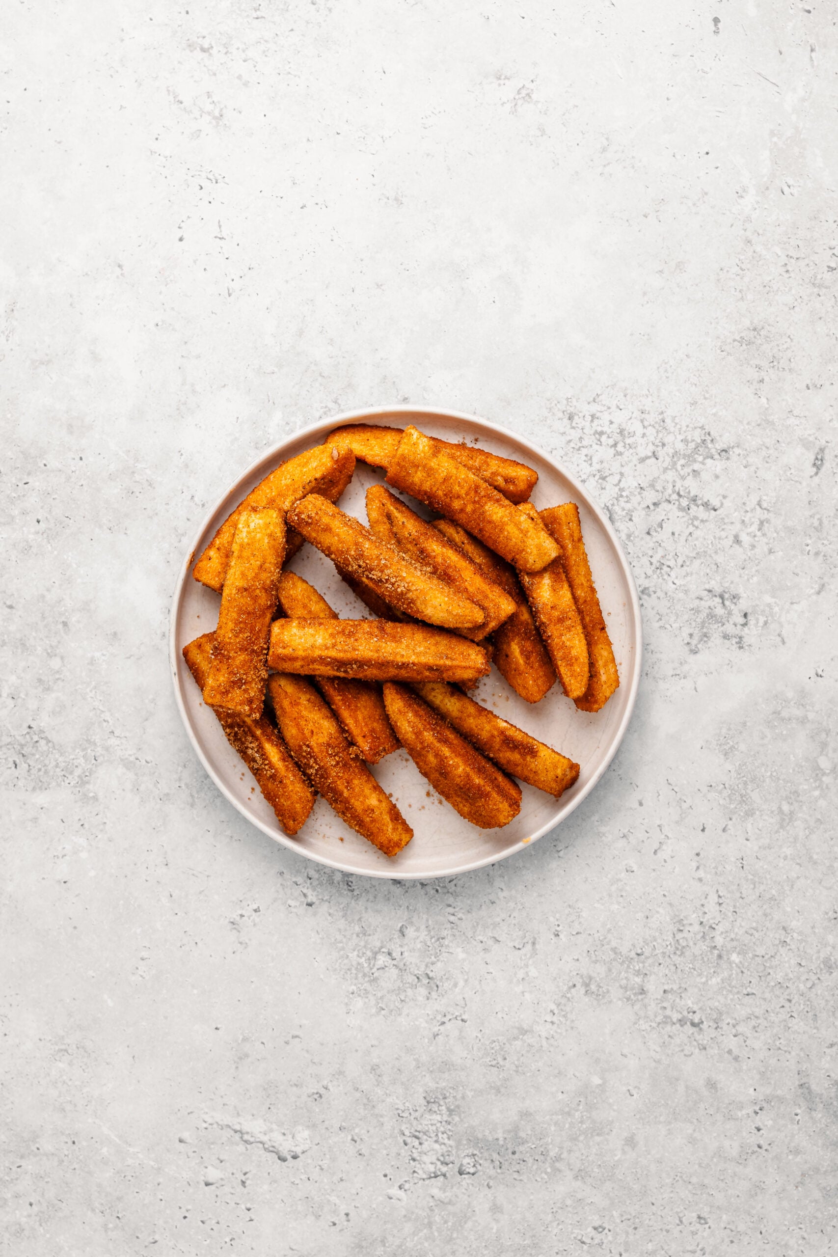 Banana strips coated in dark brown sugar and cinnamon for crispy turon - Catherine Zhang Banana strips coated in dark brown sugar and cinnamon for crispy turon