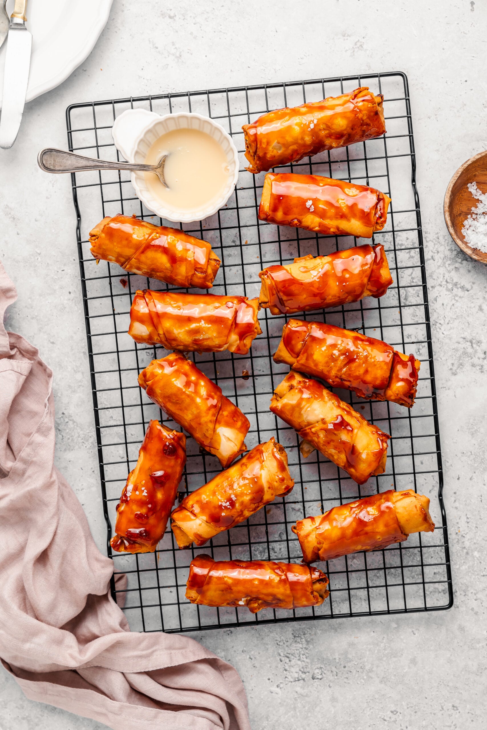 Fried turon turned in caramel and set back on a wire rack with a lacquered shell - Catherine Zhang Fried turon turned in caramel and set back on a wire rack with a lacquered shell