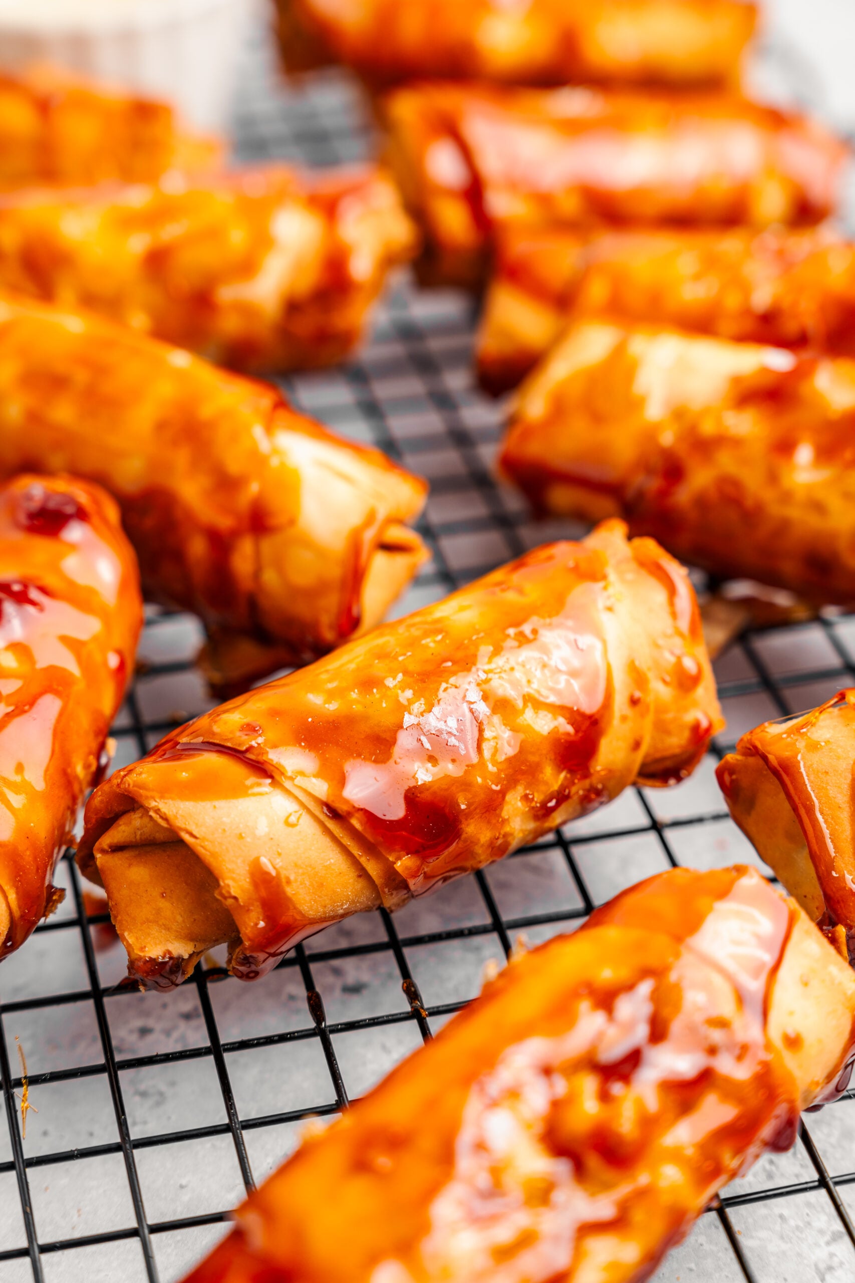 Close up of the glossy caramel shell and blistered wrapper on a crispy turon - Catherine Zhang Close up of the glossy caramel shell and blistered wrapper on a crispy turon