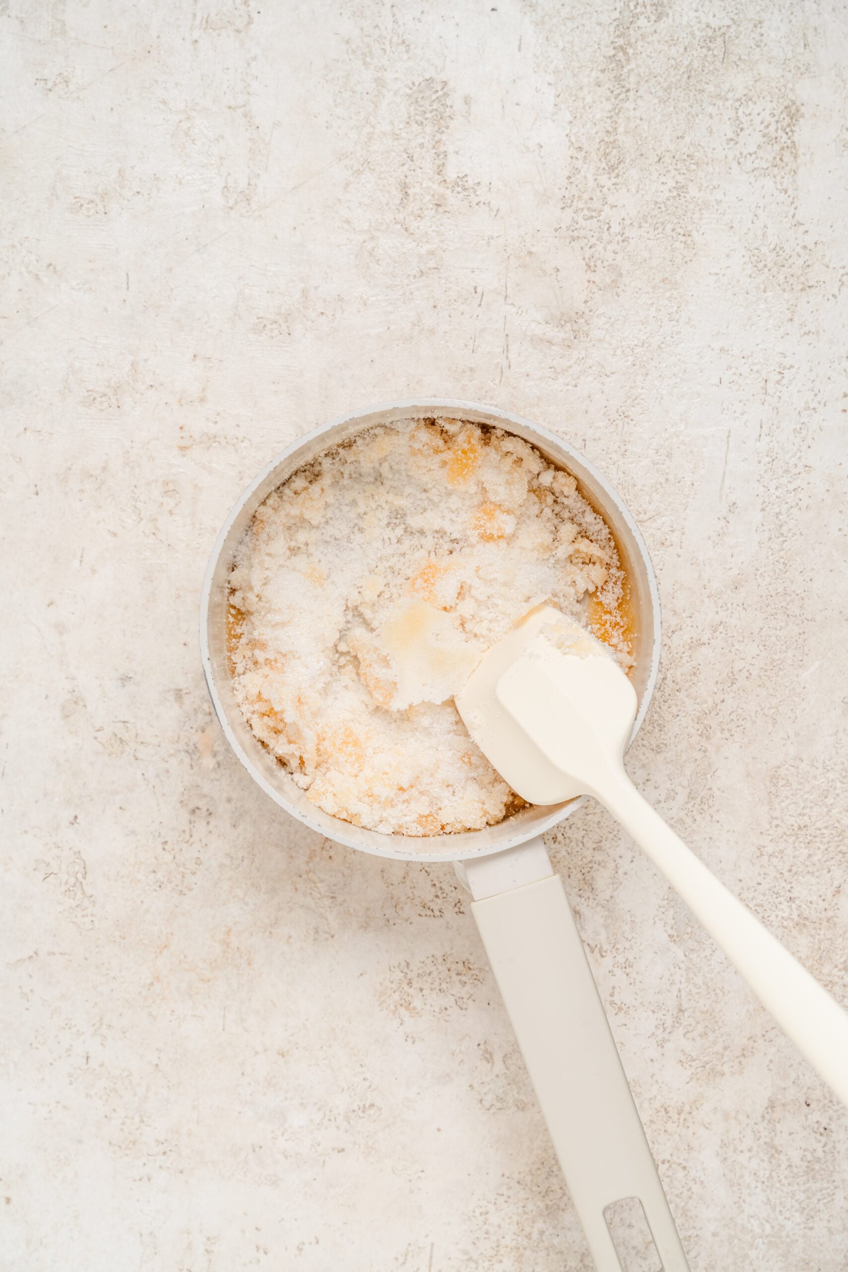 Sugar clumping and beginning to melt in the pan - Catherine Zhang Sugar clumping and beginning to melt in the pan
