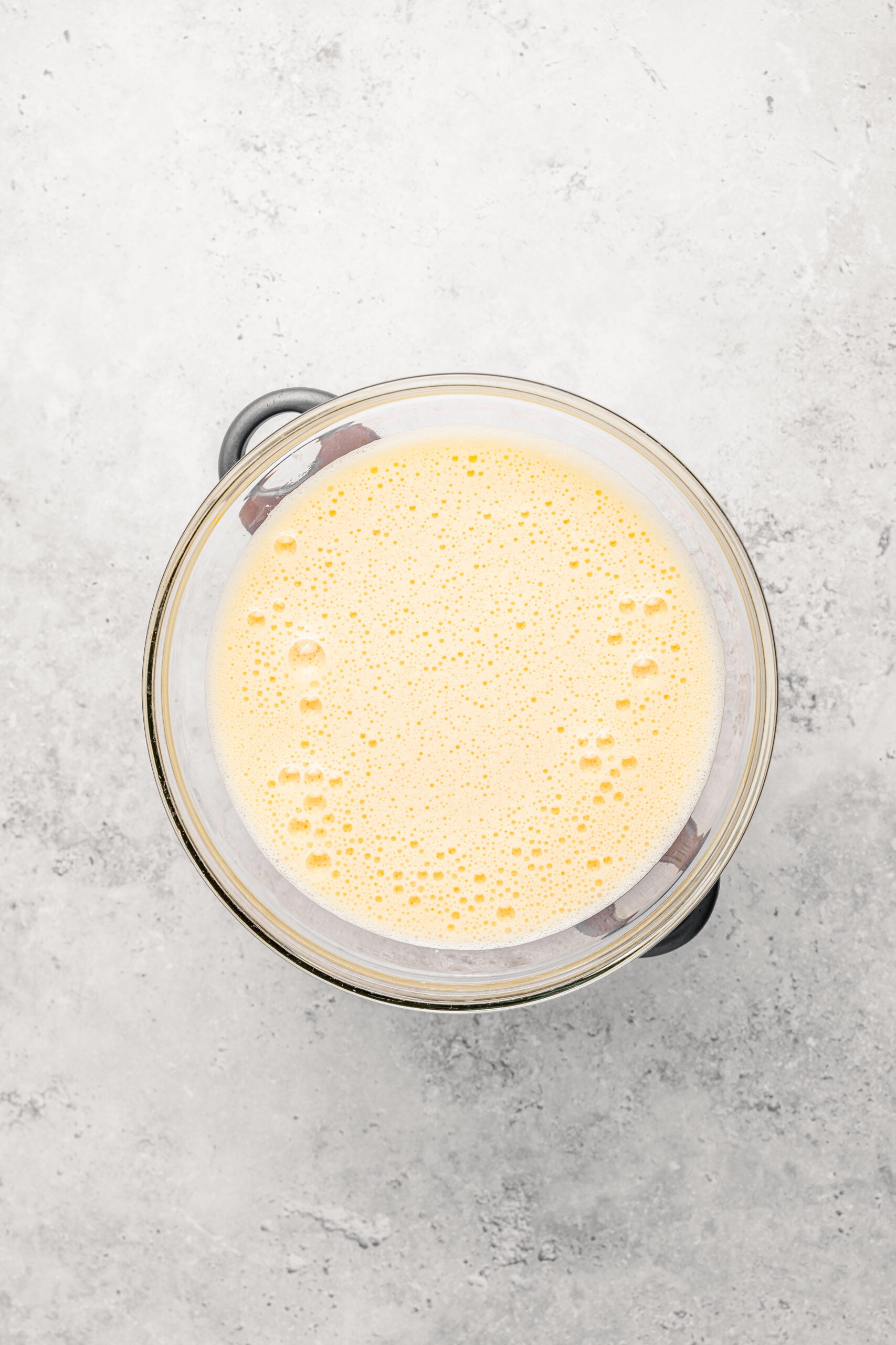 Pale frothy whipped egg and sugar mixture warmed to body temperature for Japanese castella cake - Catherine Zhang Pale frothy whipped egg and sugar mixture warmed to body temperature for Japanese castella cake