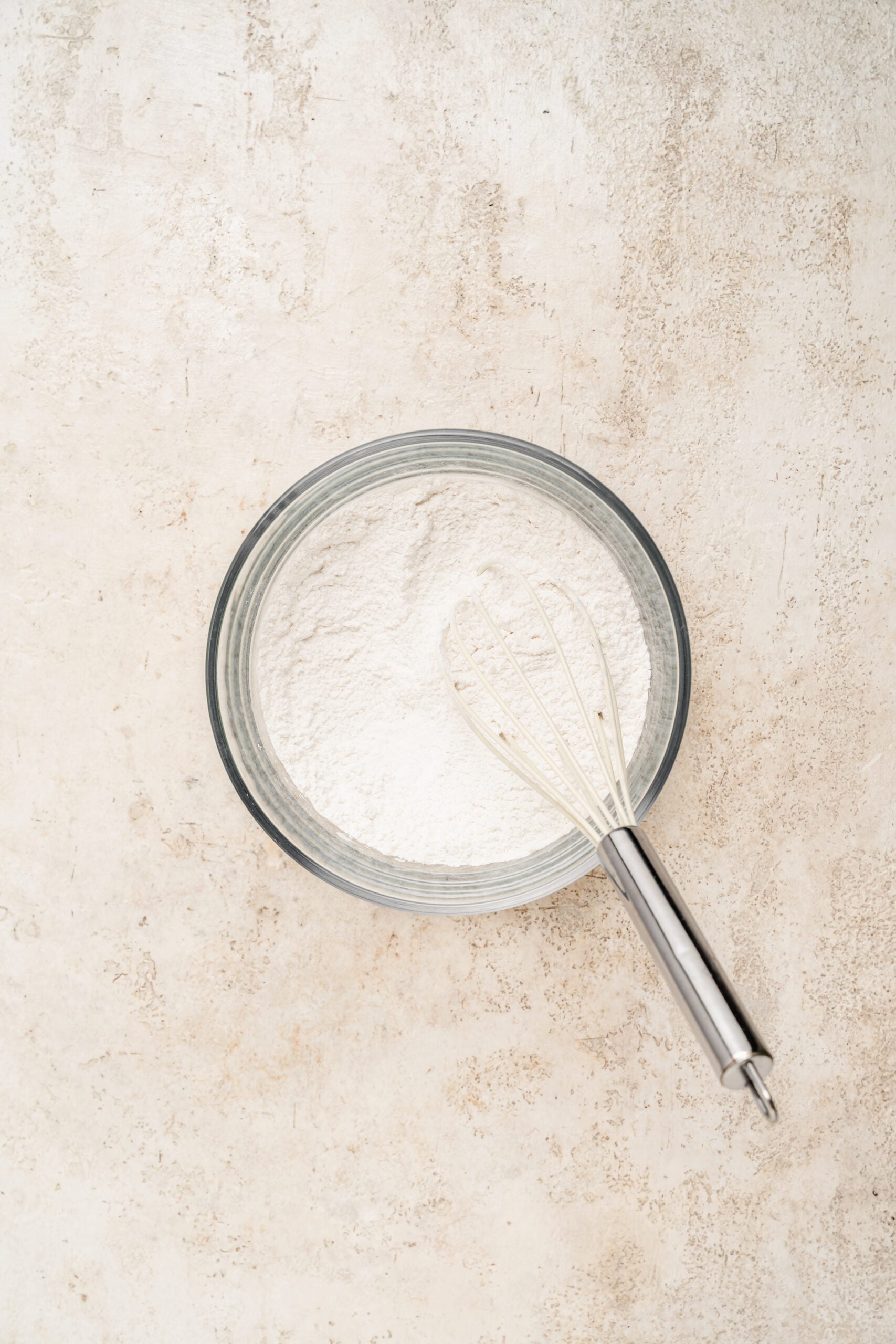 Glutinous rice flour, sugar and salt whisked together in a glass bowl - Catherine Zhang Glutinous rice flour, sugar and salt whisked together in a glass bowl