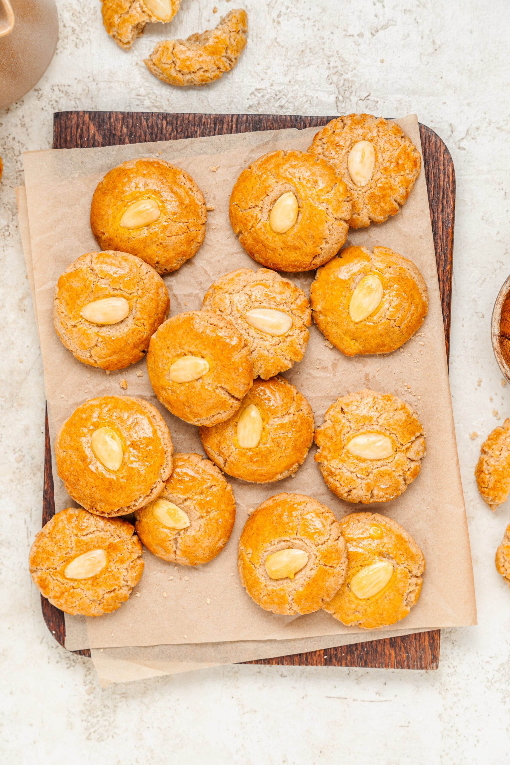 Chinese Almond Cookies - Catherine Zhang Overhead view of crackled Chinese almond cookies on baking paper