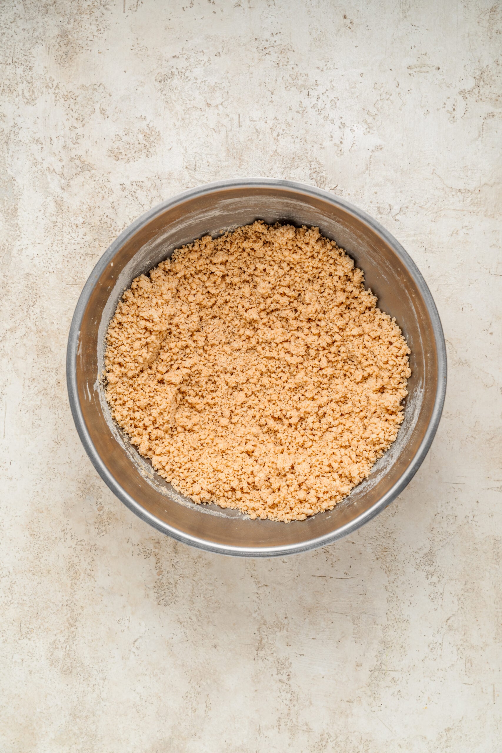 Chinese Almond Cookies - Catherine Zhang Sandy, crumbly Chinese almond cookie dough in a steel bowl