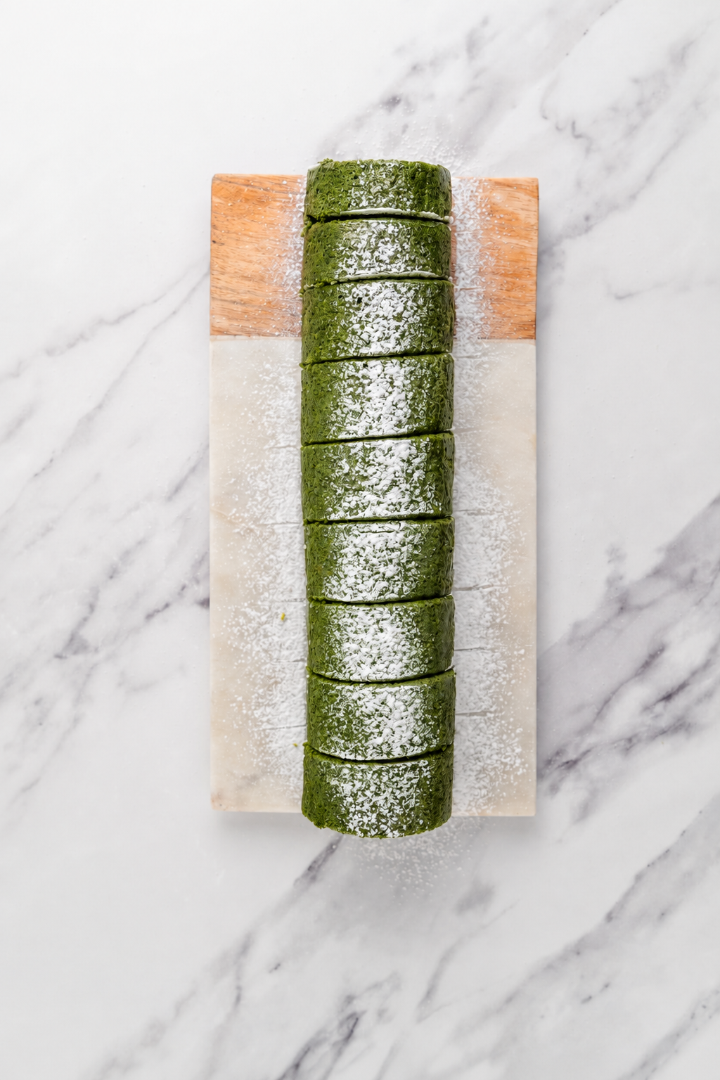 Matcha roll cake sliced - Catherine Zhang Matcha roll cake sliced into rounds showing the cream spiral
