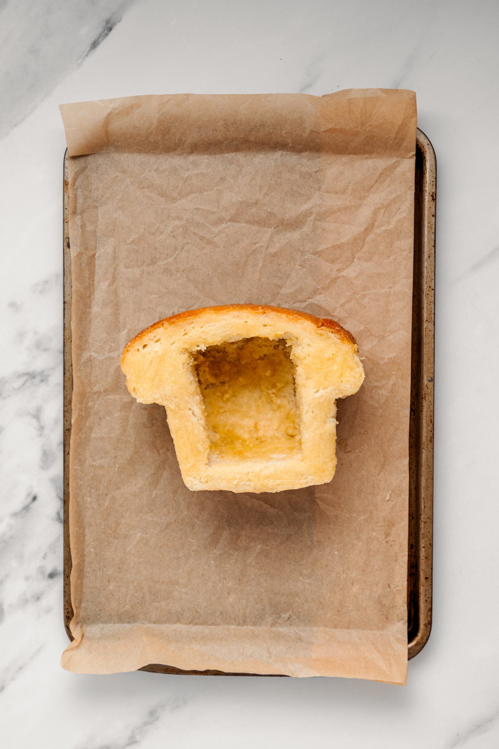 Shibuya Honey Toast - Catherine Zhang Bread box brushed with honey butter on a lined baking tray