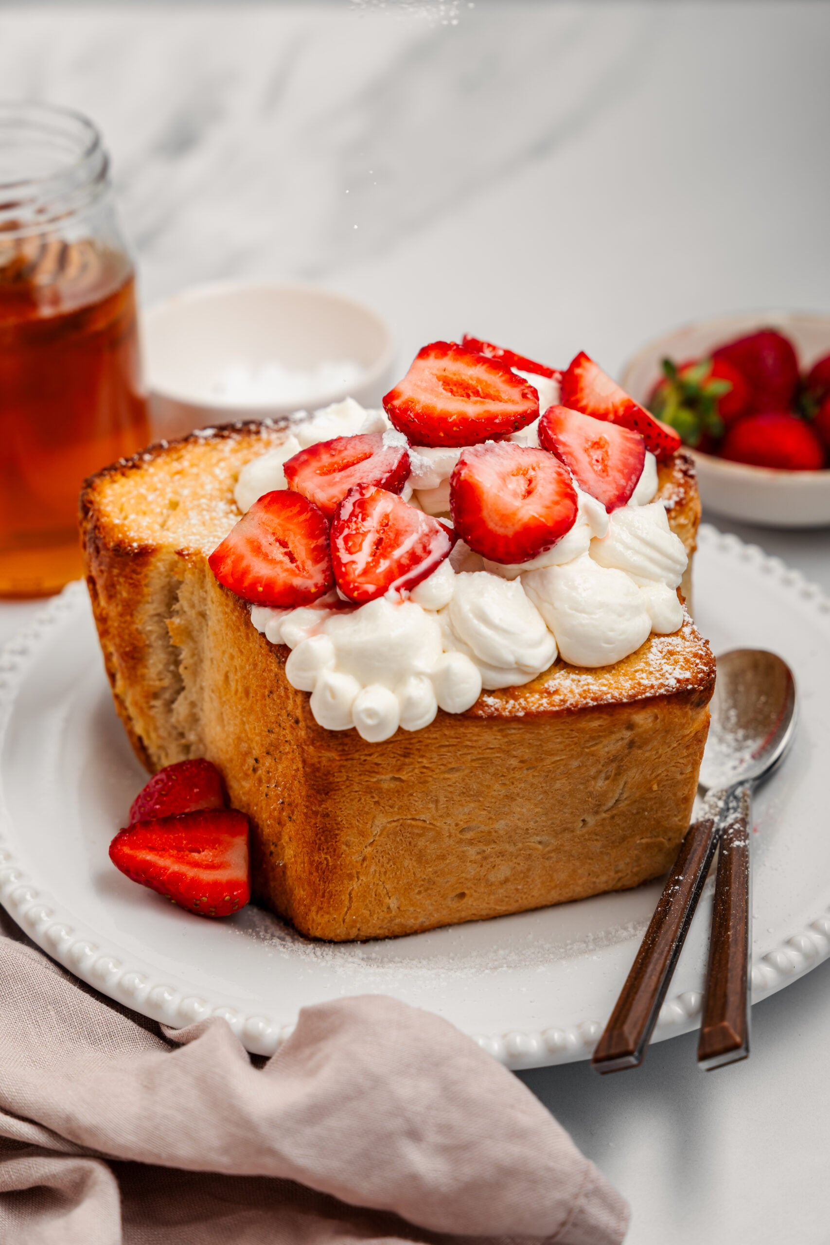 Shibuya Honey Toast - Catherine Zhang Finished Shibuya honey toast with strawberries, whipped cream and a dusting of icing sugar