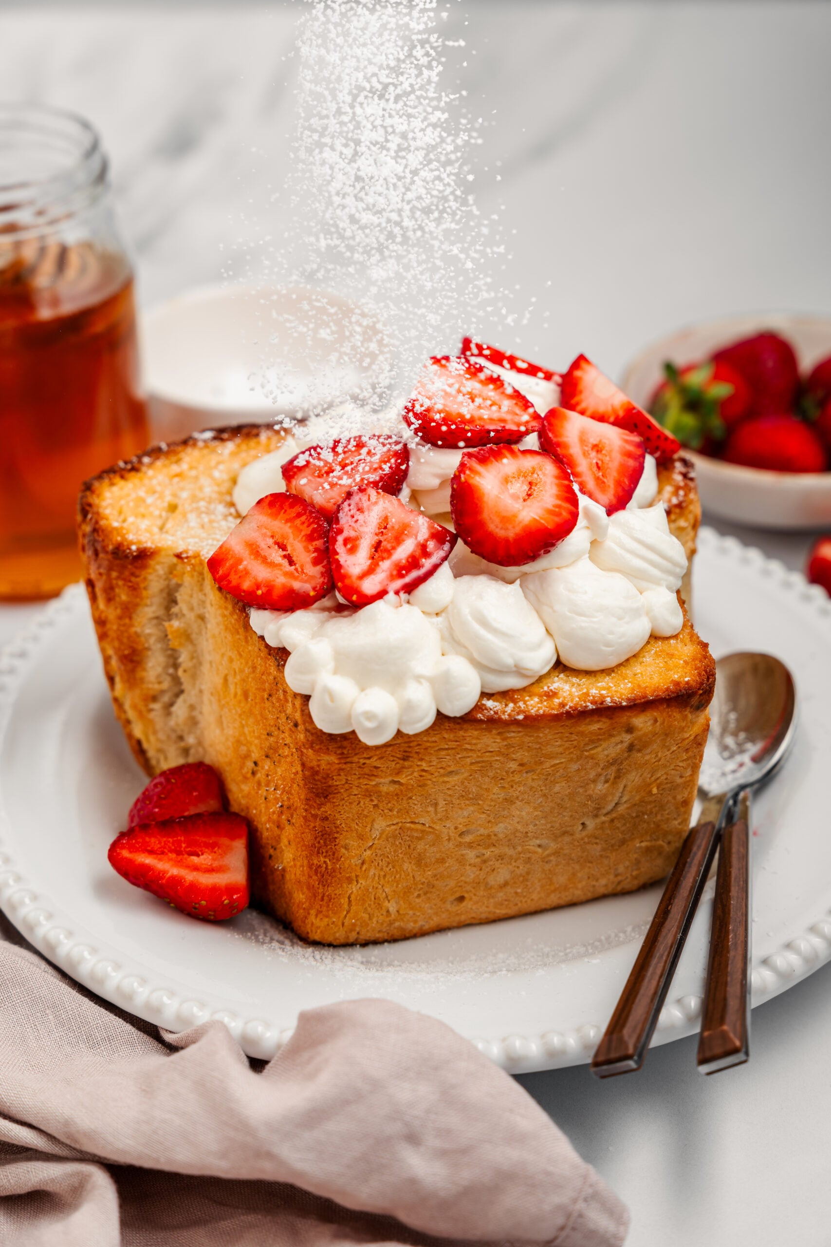 Shibuya Honey Toast - Catherine Zhang Icing sugar being dusted over Shibuya honey toast