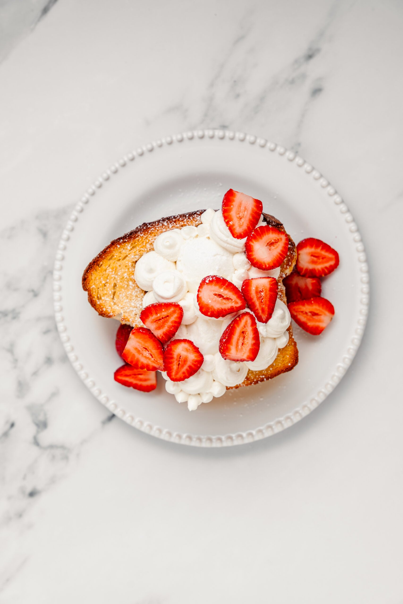 Shibuya Honey Toast - Catherine Zhang Whipped cream and halved strawberries on top of the honey toast