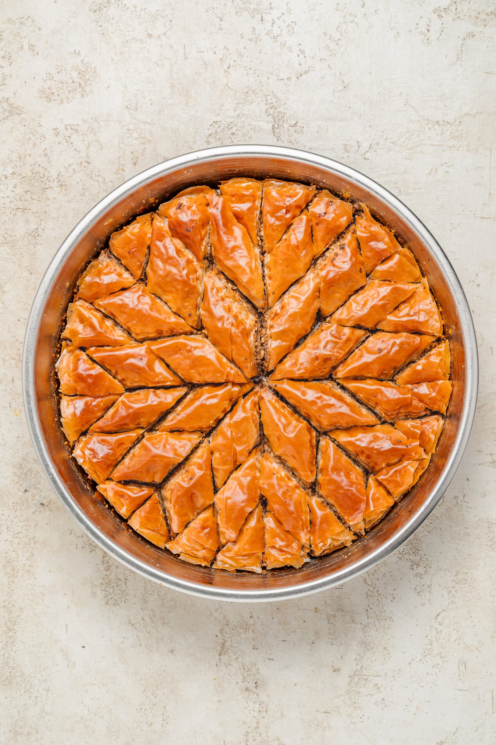 Baked golden baklava - Catherine Zhang Baklava baked to a deep even golden brown and pulled slightly from the side of the tin