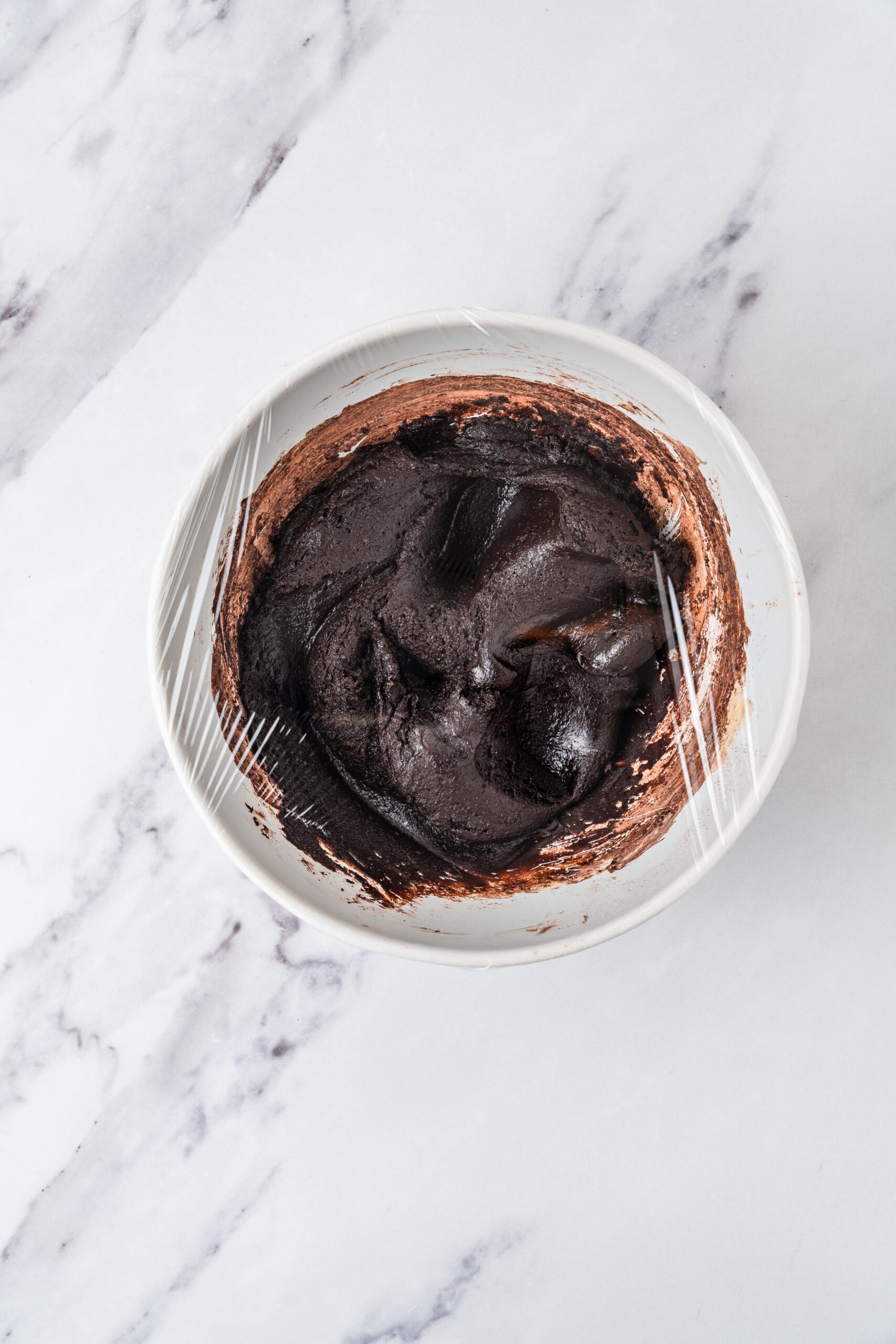 chocolate-crinkle-cookies-dough-chilling - Catherine Zhang Chocolate crinkle cookie dough covered in the bowl and ready for a four hour chill