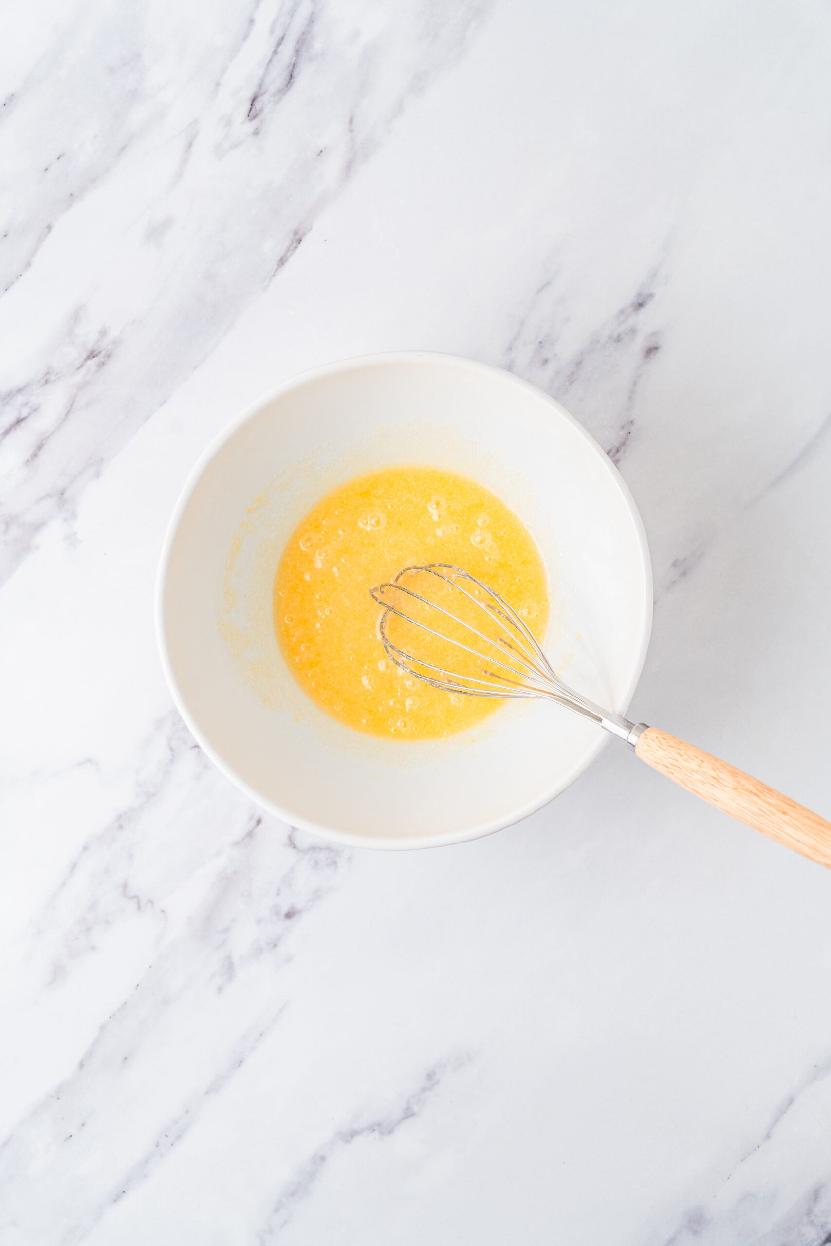 chocolate-crinkle-cookies-eggs-whisked - Catherine Zhang Eggs and vanilla whisked into the sugar and oil until the chocolate crinkle cookie mixture is glossy