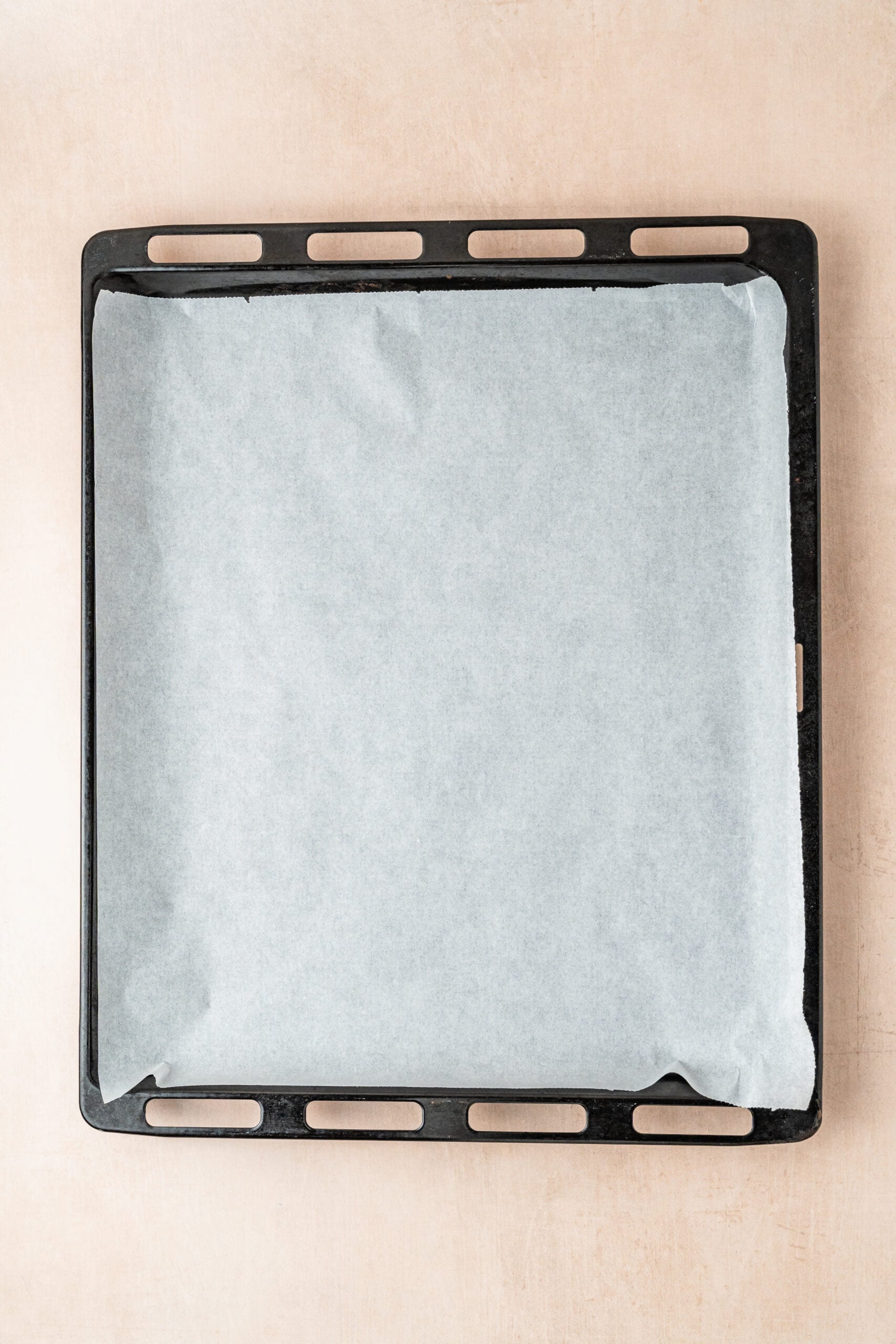 gingerbread-cookies-lined-baking-tray - Catherine Zhang A baking tray lined with parchment ready for cut out gingerbread cookies
