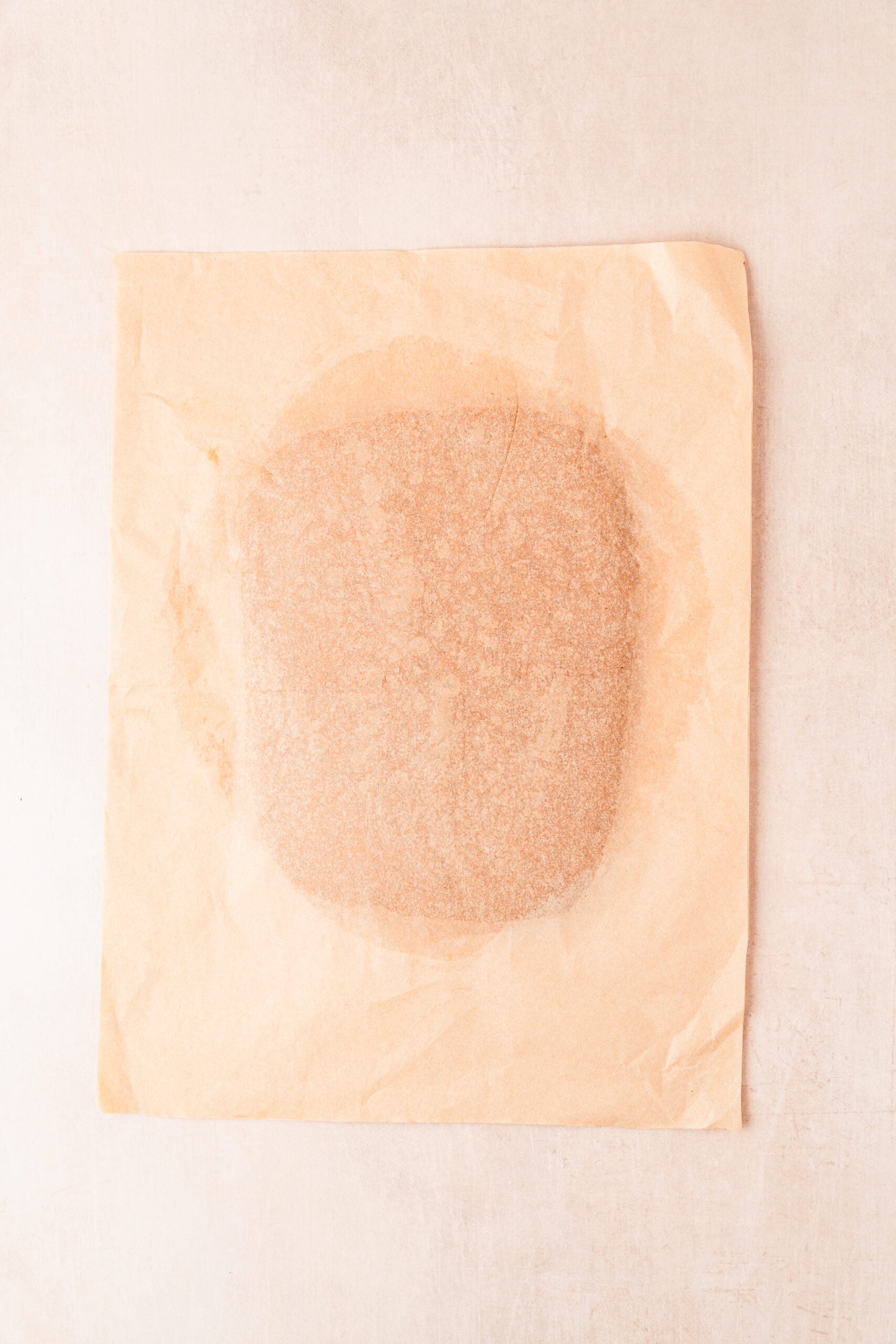 gingerbread-cookies-rolled-dough - Catherine Zhang Gingerbread cookie dough rolled to an even six millimetre thickness between two sheets of parchment