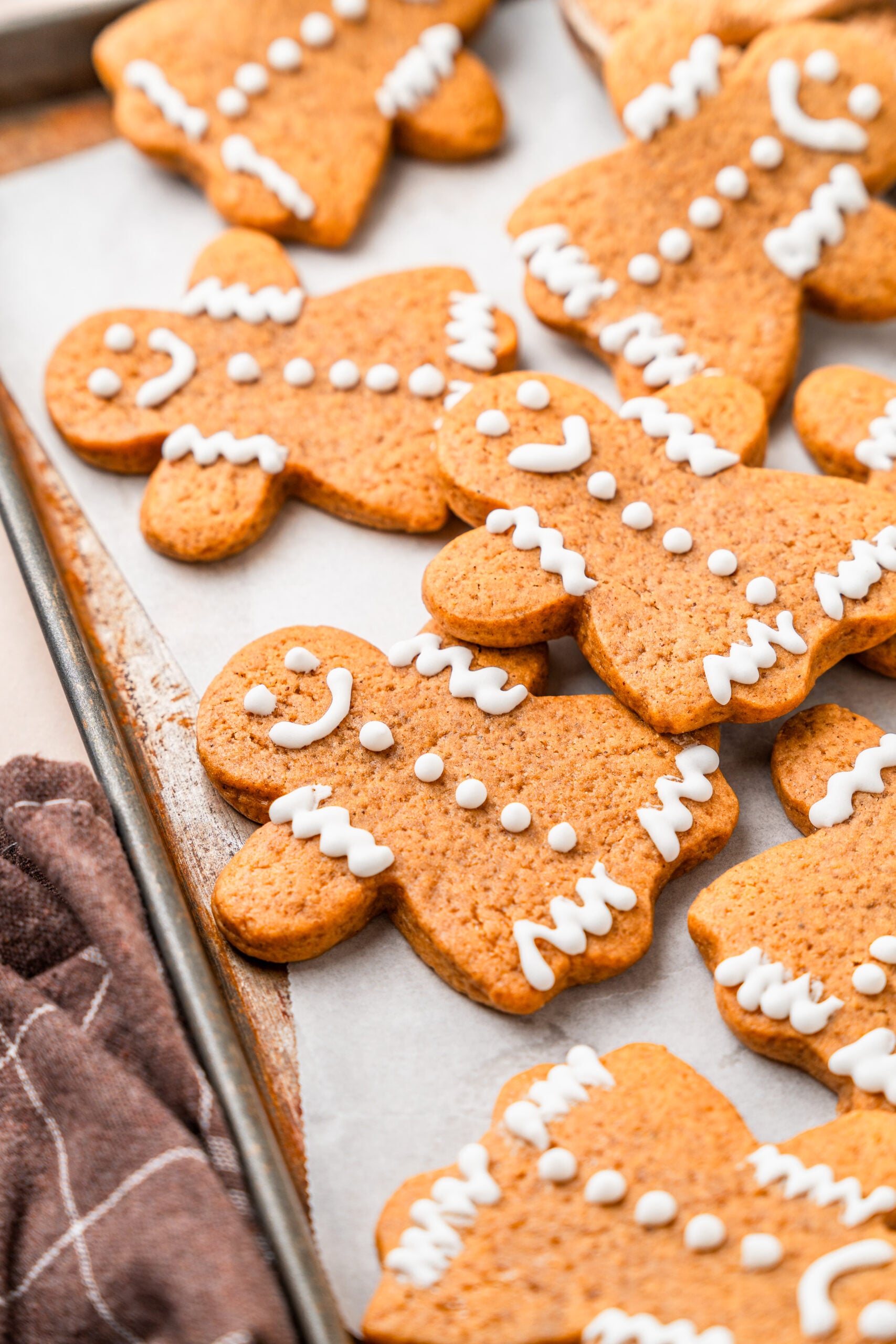gingerbread-cookies-tray-angle - Catherine Zhang A tray of cut out gingerbread cookies photographed at an angle