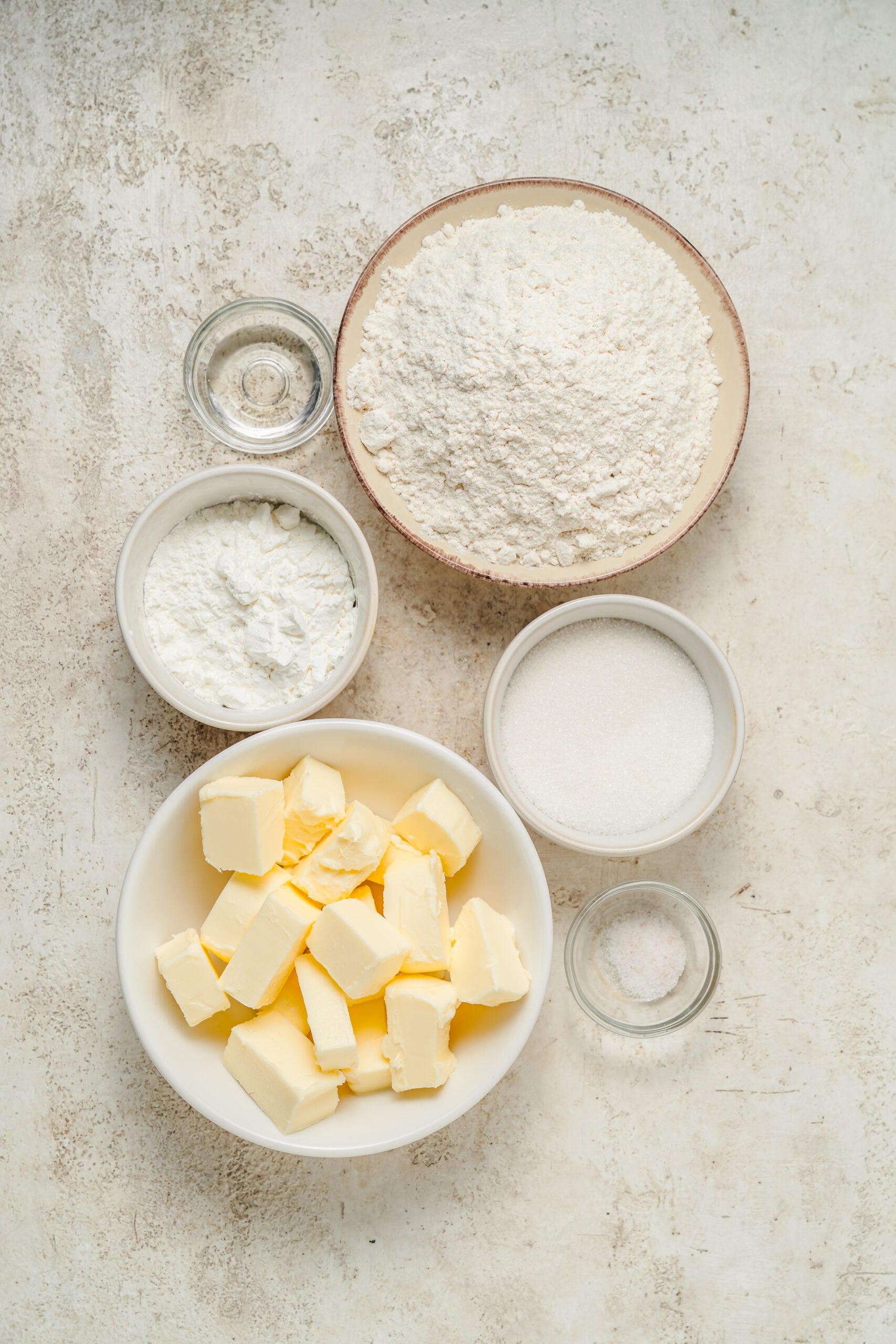 Ingredients for shortbread cookies, butter, sugar, flour, cornstarch, vanilla and salt - Catherine Zhang Ingredients for shortbread cookies, butter, sugar, flour, cornstarch, vanilla and salt