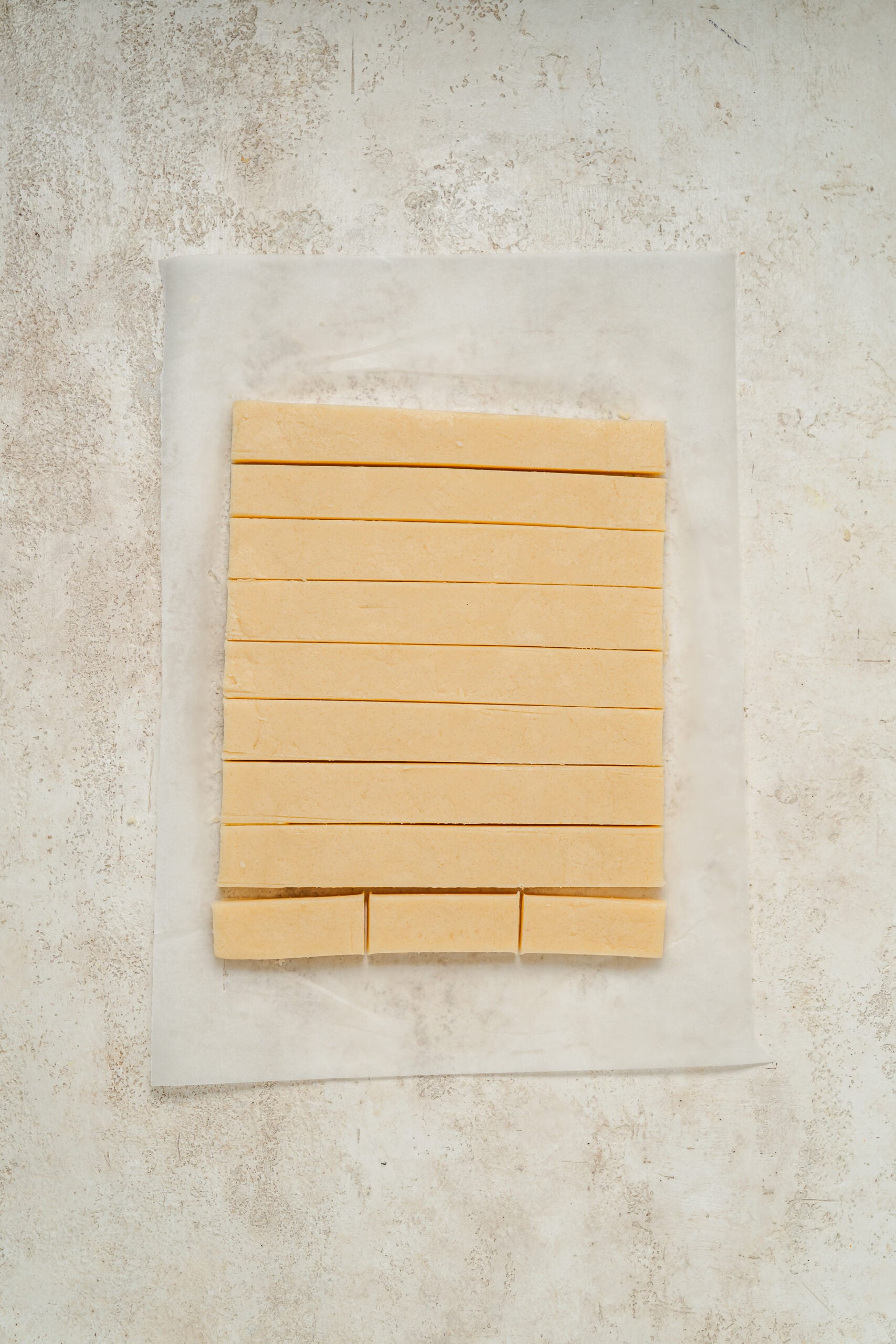 Chilled shortbread dough cut into even fingers - Catherine Zhang Chilled shortbread dough cut into even fingers