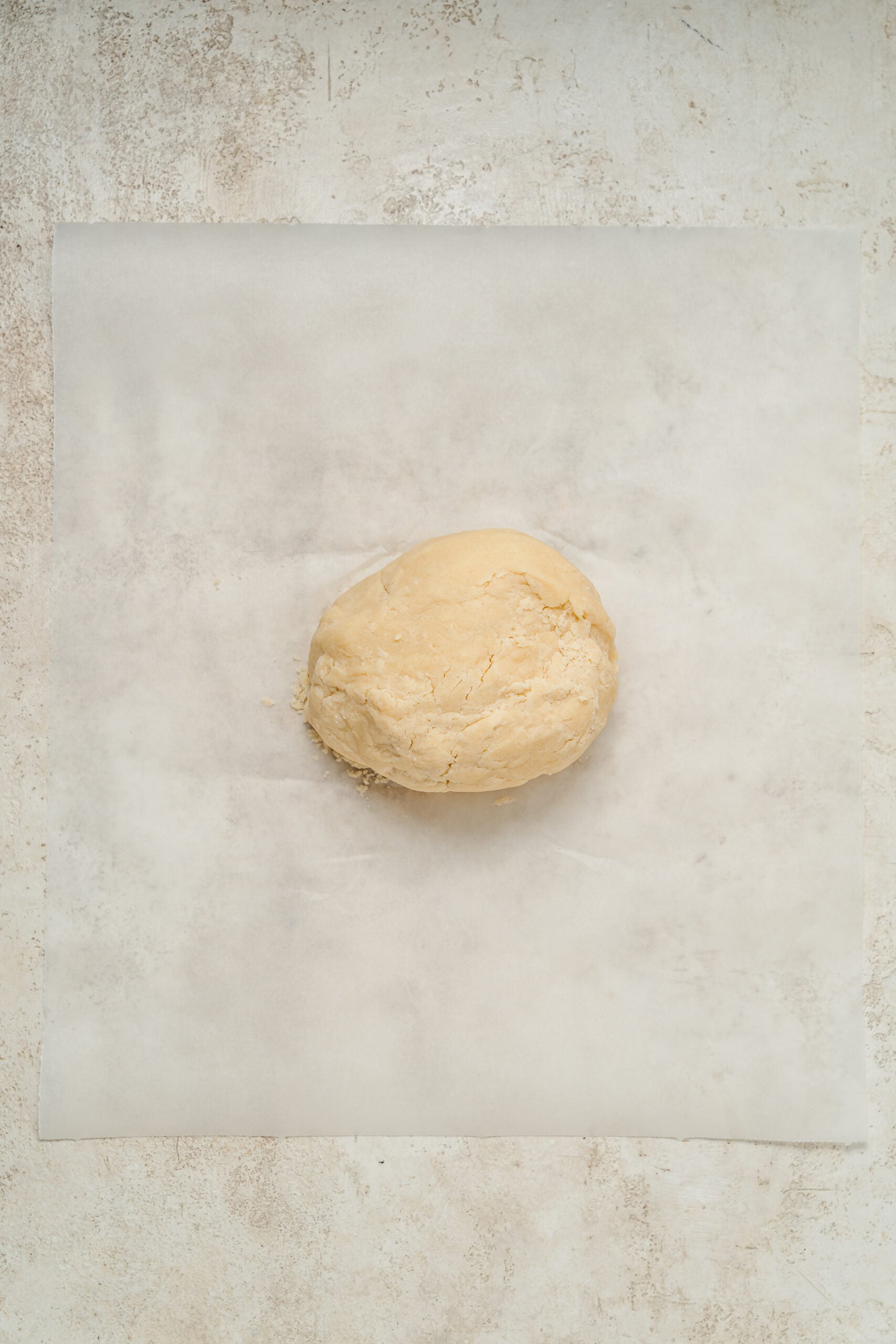Shortbread dough pressed into one smooth mass on baking paper - Catherine Zhang Shortbread dough pressed into one smooth mass on baking paper