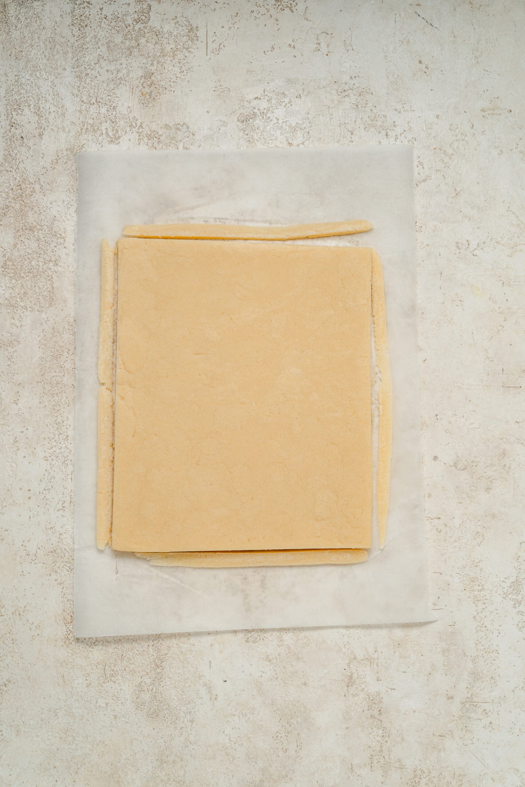Chilled shortbread dough trimmed into a neat rectangle - Catherine Zhang Chilled shortbread dough trimmed into a neat rectangle