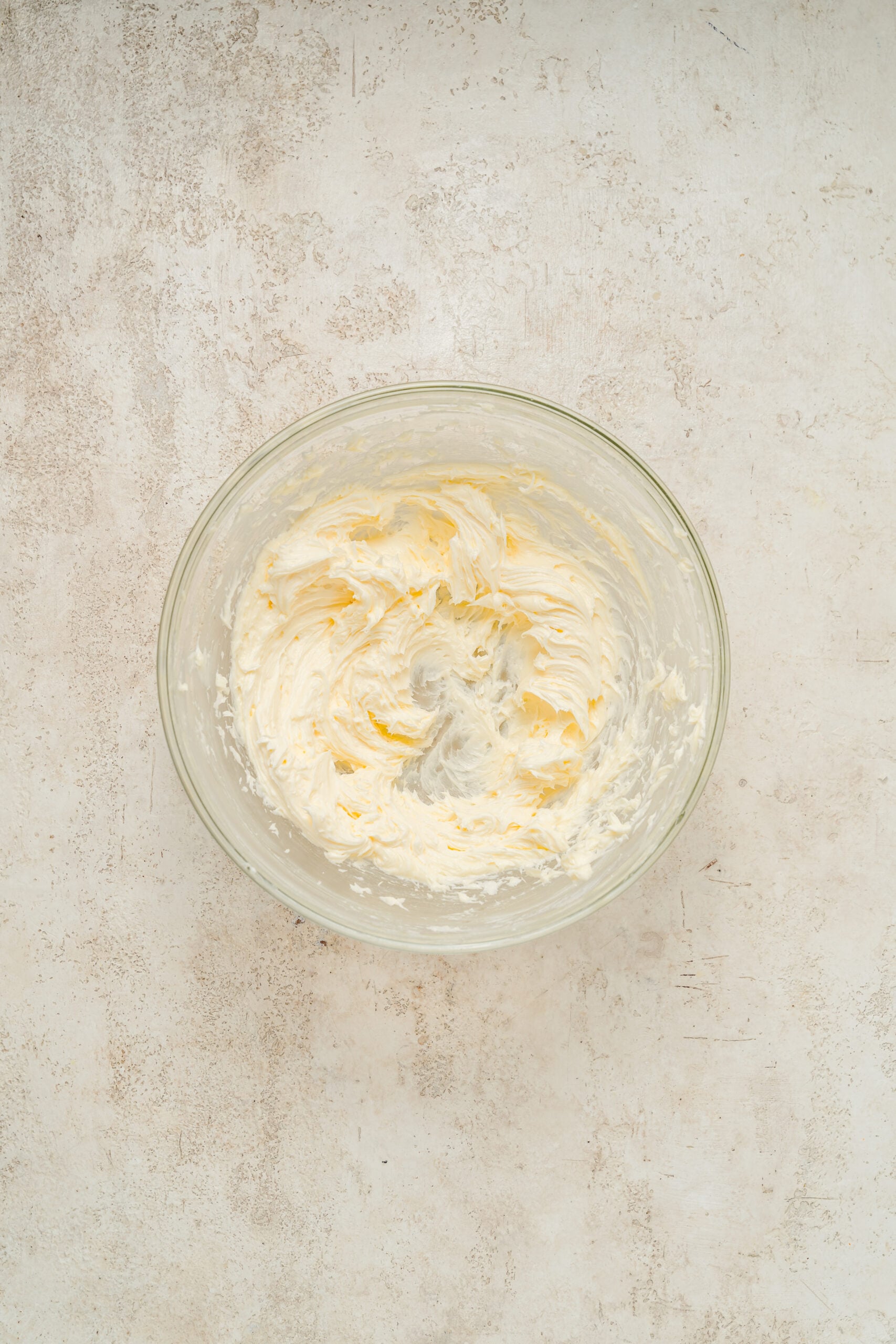 Butter and powdered sugar creamed until pale for snowball cookies - Catherine Zhang Butter and powdered sugar creamed until pale for snowball cookies